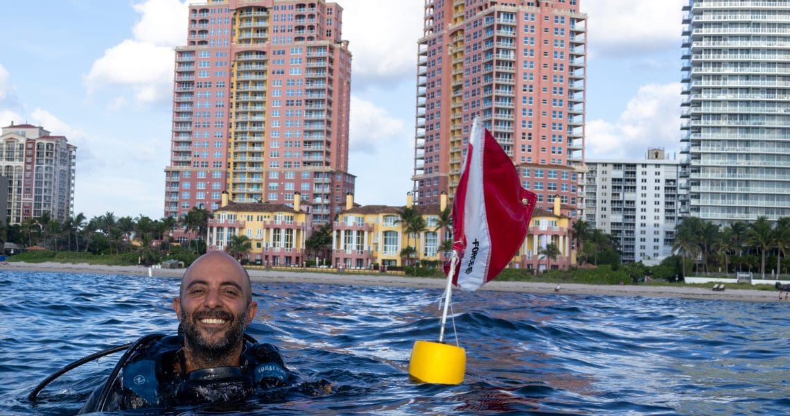 Scuba Diver at the surface with a Diver Down flag