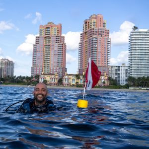 Scuba Diver at the surface with a Diver Down flag