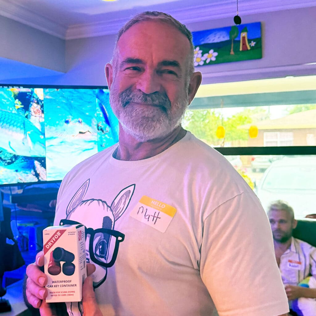 Matt Constantine holding his prize, the DryFob