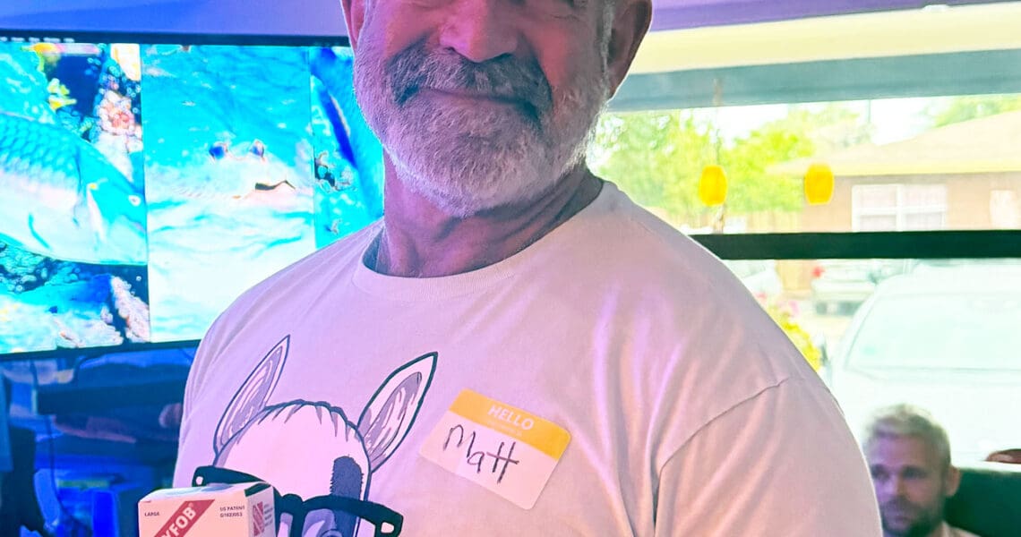 Matt Constantine holding his prize, the DryFob