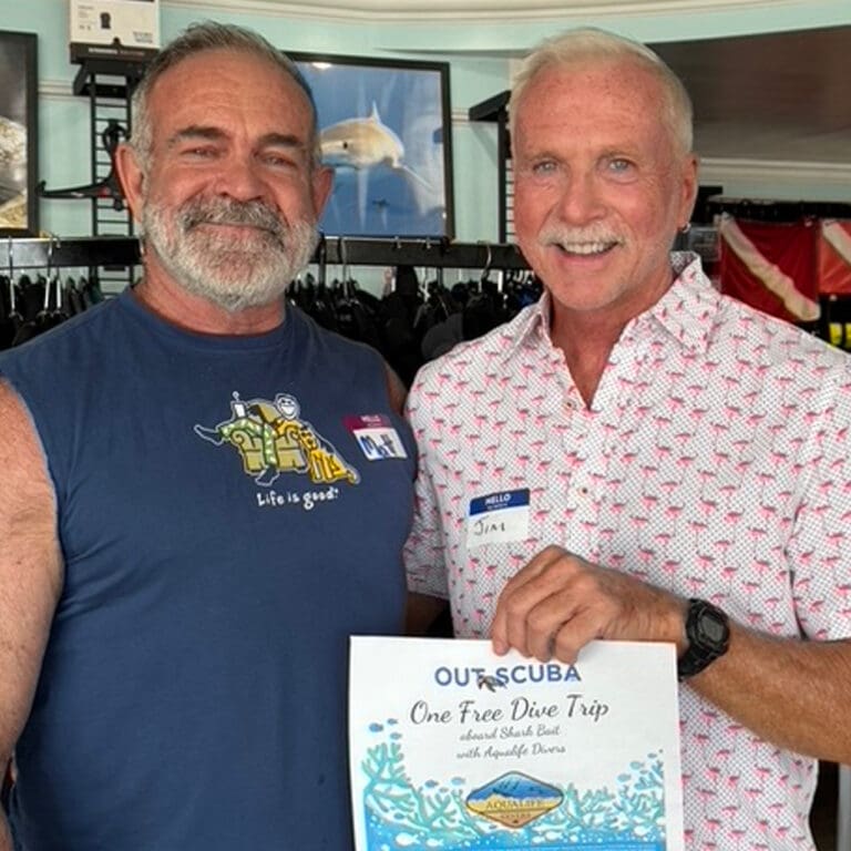 Door prize winner Jim LaBrie presented his winning ticket by last quarter's winner Matt Constantine.