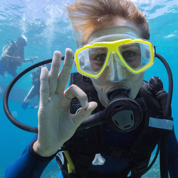 Scuba diver giving the OK Hand signal